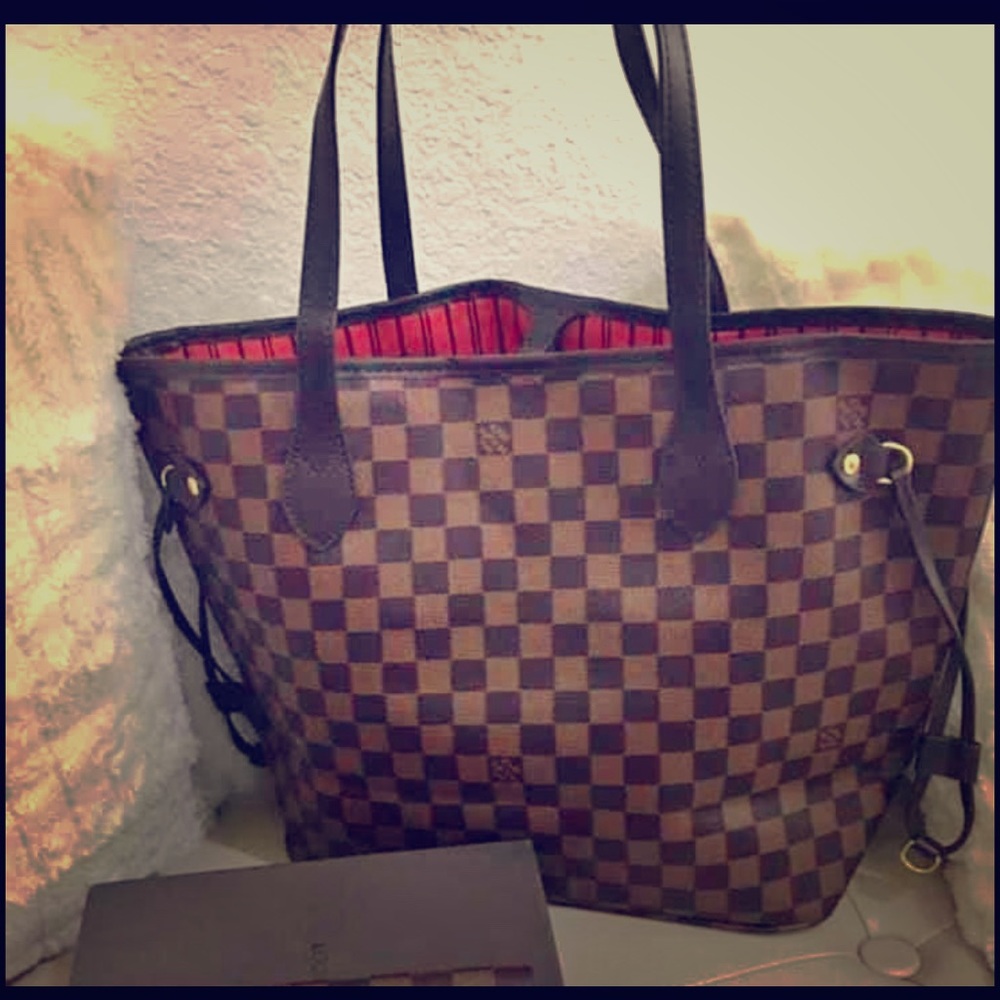 pretty brown checker board Tote with red lining.